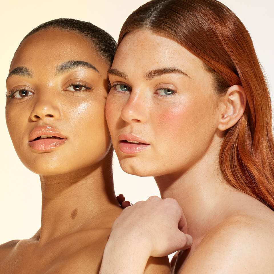 An image of 2 models wearing bronzing drops